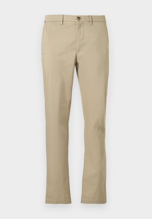 Beige chinos, kas izgatavoti no viegla auduma, ar taisno kāju dizainu, pogu aizdari un divām priekšējām kabatām. Gluda tekstūra ar minimālu dekoru.