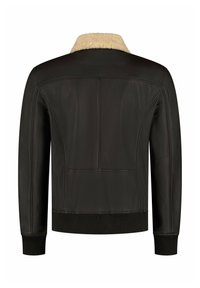 Brown leather jacket with a cream-colored shearling collar, ribbed cuffs and hem, featuring a smooth finish and minimalist design.