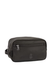 Svart necess�är i nylon med dragkedja, utrustad med en framficka och en texturerad logga. Kompakt rektangulär form med ett sidofack.