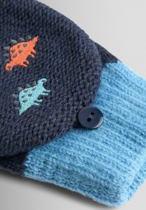 Strikket blå og marineblå stof med broderede dinosaurer i orange og lys blå. Har en mørk knapdetalje på den marineblå del.