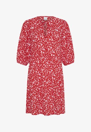 Abito rosso al ginocchio con stampa floreale bianca e rosa, maniche a tre quarti a sbuffo e un piccolo fiocco all'alto scollo.