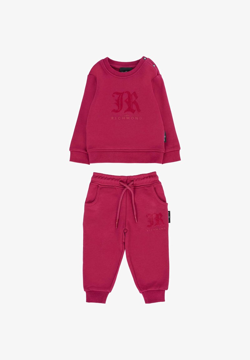 Czerwona bawełniana bluza z okrągłym dekoltem i zatrzaskami, z tonalnym logo "R". W komplecie z pasującymi czerwonymi spodniami dresowymi z kieszeniami.