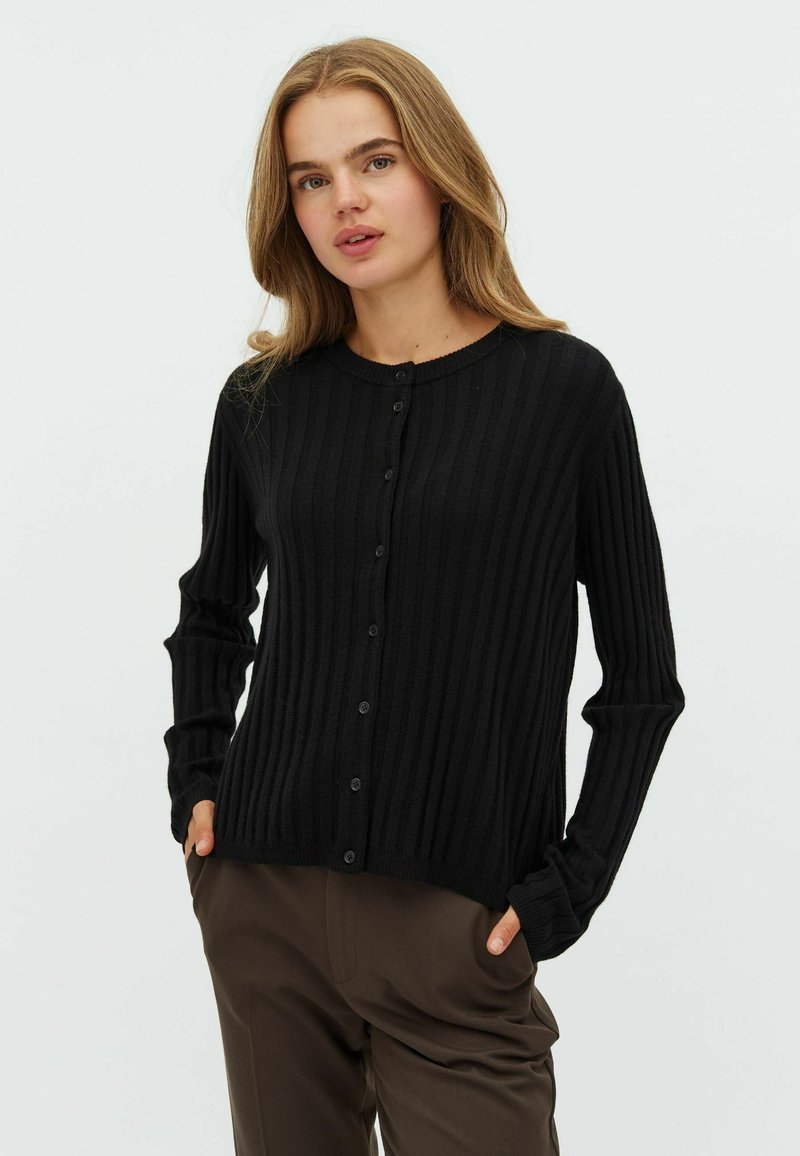 Black ribbed cardigan with long sleeves, round neckline, and front button closure. Material appears soft with subtle texture.
