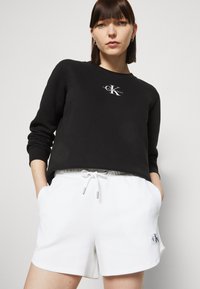 Calvin Klein Jeans MONOLOGO REGULAR CREWNECK - Sweatshirt - black