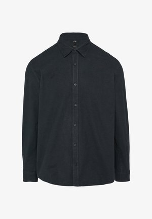 Chemise noire à boutons en tissu texturé. Dotée d'un col, de manches longues et d'un ourlet droit. Boutons sur le devant et aux poignets.