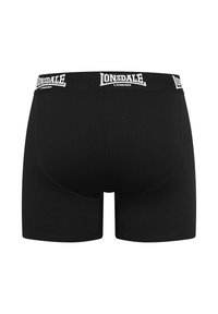 Black boxer briefs made of smooth fabric, featuring a white Lonsdale logo on the elastic waistband. The design includes a contoured rear.
