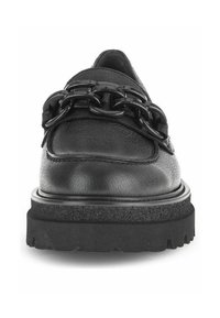 Scarpe in pelle nera con suola spessa e testurizzata, dettagli in catena sulla parte superiore e finitura liscia sul collo del piede.