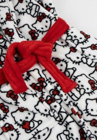 White fleece robe with red Hello Kitty pattern; features red belt and black outlines of character with bows, soft texture, casual design.