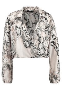Blusa cropped a maniche lunghe con stampa serpente beige, nera e marrone e design incrociato a V.