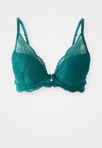 Teal kanten bralette met een driehoekige vorm, golvende randen, verstelbare bandjes en een decoratieve zilveren charm in het midden.