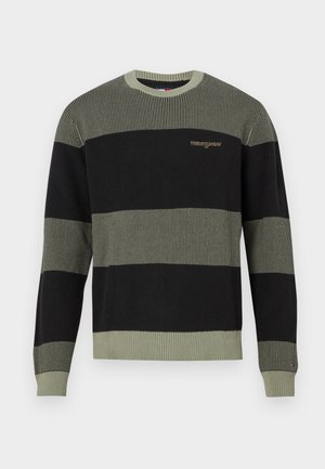 Musternitega must ja oliivroheline kampsun, millel on soonikkoes, ümar kaelus ja tikitud "tommyjeans" logo ees.