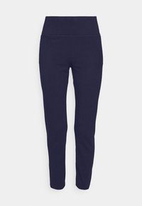Marinblå leggings i stretchmaterial med hög midja, figurnära passform och sidofickor. Slät yta, minimala sömdetaljer.