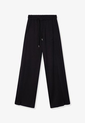 Black wide-leg pants made of soft fabric, featuring an elastic waistband with drawstring, front pleats, and side slits.