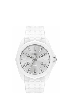 White Diesel wristwatch with textured silicone strap, round face, silver dial, bold hour markers, and three hands showing 10:10:38.