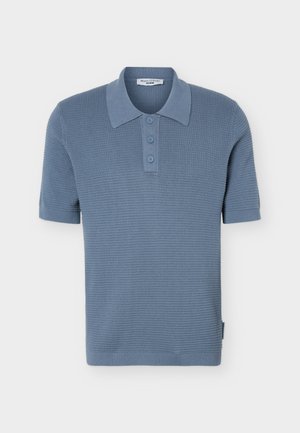 Light blue short-sleeve knit polo shirt with textured pattern, three buttons, and a classic collar, displayed on a white background.