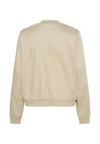 Veste bomber beige clair, en mélange de coton, avec des poignets et un col côtelés, un ourlet élastiqué, texture unie, design minimaliste, sans fermetures visibles.