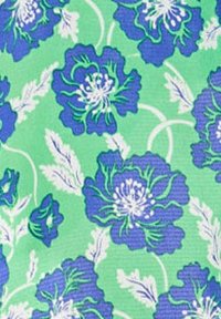 Floral fabric featuring large blue flowers with white accents on a green background, showcasing a textured weave with a vibrant pattern.