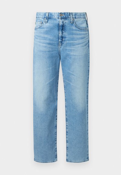 Heledad sinine denim, sirge jala kujundusega, viis taskut, lukuga ja õrnalt kulunud tekstuuriga.