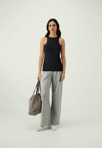 Navy sleeveless top, light gray plaid wide-leg trousers, gray tote bag, white sneakers, smooth fabric, relaxed silhouette.