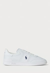 White sneakers made of synthetic material, featuring a smooth texture, lace-up design, and a blue logo accent on the side.