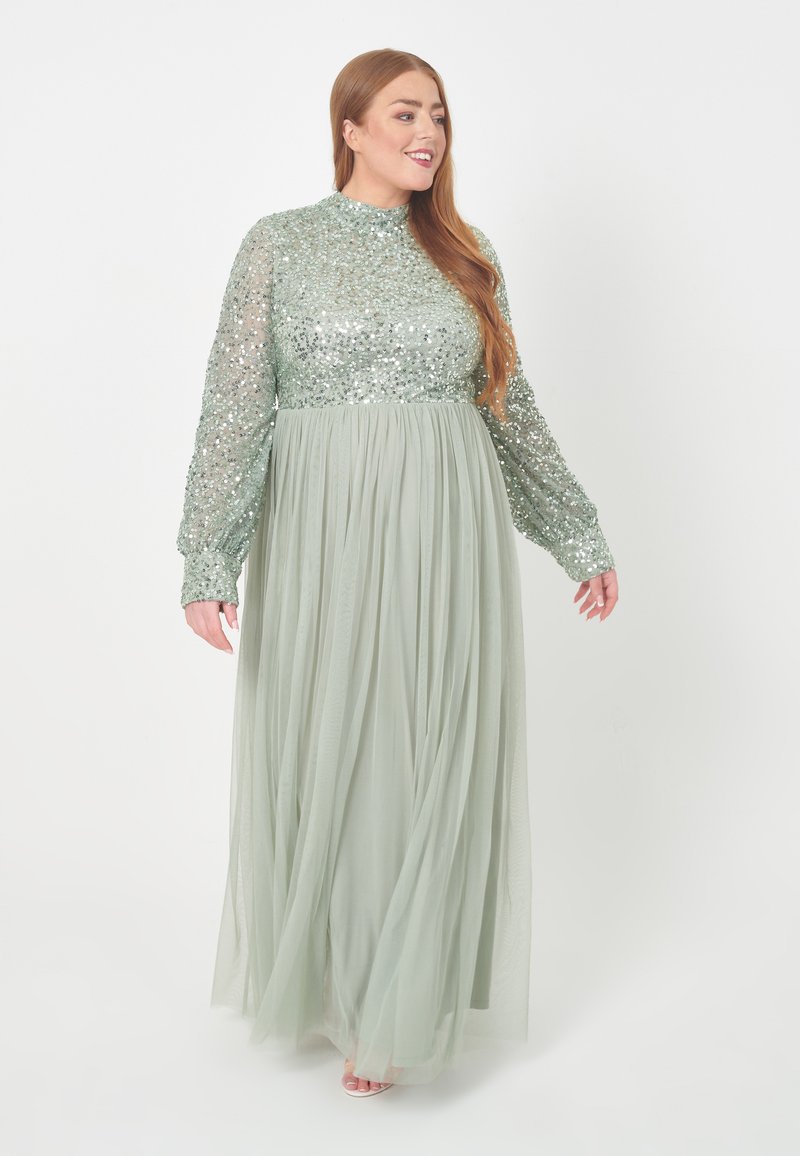 Mintgrünes Maxikleid mit einem Pailletten-Oberteil, langen, transparenten Ärmeln und einem schwingenden Tüllrock. Verfügt über einen hohen Ausschnitt und einen elastischen Taillenbund.