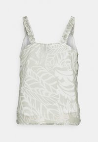 Haut sans manches vert clair avec un motif de feuilles, doté de bretelles à volants et d'une coupe décontractée. Tissu lisse avec une surface légèrement texturée.