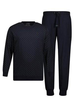 Navy pullover and pants set. Pullover features white polka dots, ribbed cuffs, and neckline. Pants have an elastic waistband and side pocket.