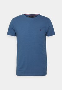 Blue cotton t-shirt with a round neck, short sleeves, and a small logo accent on the chest. Simple and classic design.