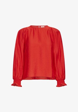 Sarkana garā piedurkņu blūze no viegla materiāla. Iespējas iekļauj apaļu dekoltē, savāktus plecus un elastīgas piedurkņu malas ar frillēm.