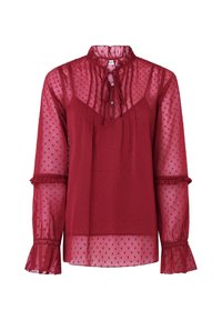 Blusa trasparente bordeaux con polka dot testurizzati, colletto alto e dettaglio con fiocco. Presenta maniche a volant e chiusure a bottoni.