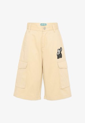 Shorts cargo beiges avec poches latérales, bouton à l'avant, étiquette Kenzo à la taille, et graphisme d'éléphant avec "1970" sur la cuisse droite.