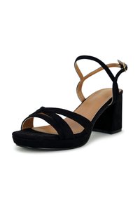 Black suede block-heeled sandals feature multiple crisscross straps and an ankle strap with a buckle. Smooth inner lining and closed heel.