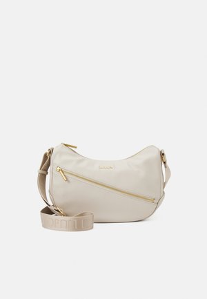 Sac bandoulière en cuir beige avec fermeture éclair dorée et sangle réglable en tissu avec logo de la marque embossé.