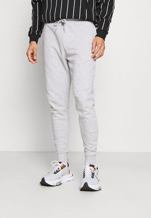 Pantaloni jogger grigi realizzati in un tessuto morbido, con design a gamba affusolata, cintura elastica con cordino e polsini a costine.