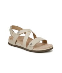 Beige sandalen met kruisbandontwerp, gevoerd voetbed en platte zool. Beschikt over metalen accenten en een gestructureerd oppervlak voor comfort.