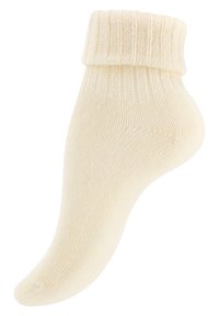 Cremfarbene Knöchelsocke mit geripptem Bund, weicher Textur und glattem, nahtlosem Design. Geeignet für legere oder Innenanwendungen.