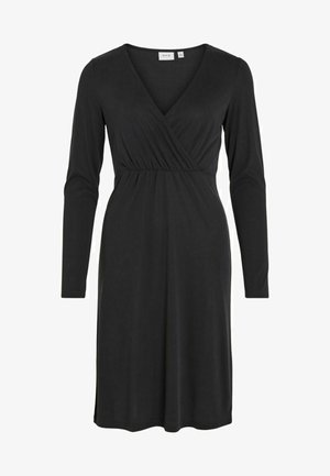 Svart långärmad klänning med V-ringning och vecksömn vid midjan. Mjuk tyg med en jämn textur och knä-lång längd.