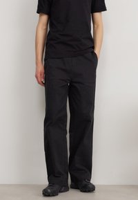 Calvin Klein MODERN RELAXED WIDE - Broek - black
