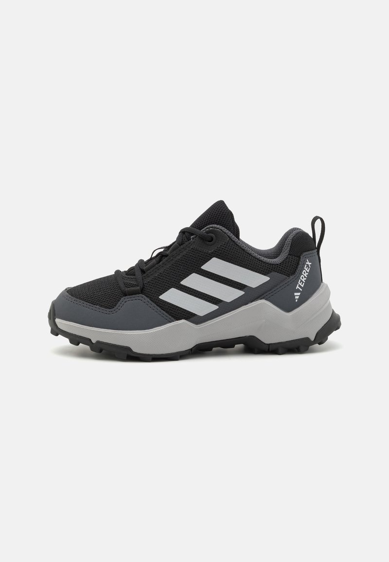Black and gray hiking shoes with a mesh upper, reinforced toe cap, and textured rubber sole. Features three white stripes on the side.