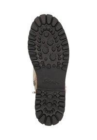 Semelle de botte en caoutchouc noir avec un motif de semelle profond, présentant des crampons inclinés et arrondis pour une meilleure traction. Marque "Sioux" en relief visible.