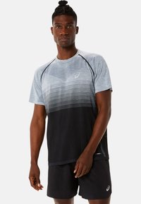 Men's athletic shirt in gradient blue to black, short sleeves, crew neck, textured material, with a small logo on the chest.