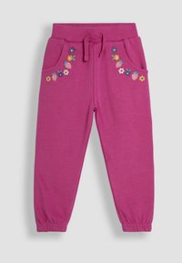 Fuchsia joggingbroek met elastische tailleband en trekkoord. Voorzien van twee zijzakken en bloemenborduursel nabij de zakken. Zacht katoen stof.