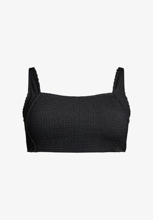 Bralette nera in tessuto testurizzato con spalline larghe e design solido e senza cuciture, caratterizzata da un motivo intrecciato e in rilievo su tutta la superficie del tessuto.