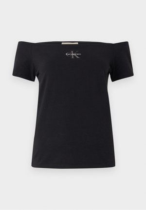 Tricou negru fără umeri, fabricat din bumbac, cu mâneci scurte. Prezintă un mic logo gri Calvin Klein în față.