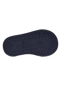 Suola di scarpa in gomma nera con un motivo geometrico texturizzato e dettaglio "FLEX ZONE". Include marchi di identificazione e indicazioni della taglia.