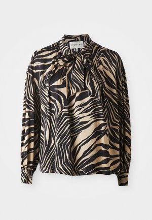 Long-sleeve shirt in smooth fabric featuring a bold black and gold zebra stripe pattern, with a bow tie detail at the neckline.