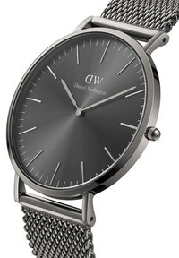 Silver mesh strap watch with a dark gray round dial. Features minimalistic hour markers, logo, and a polished stainless steel casing.