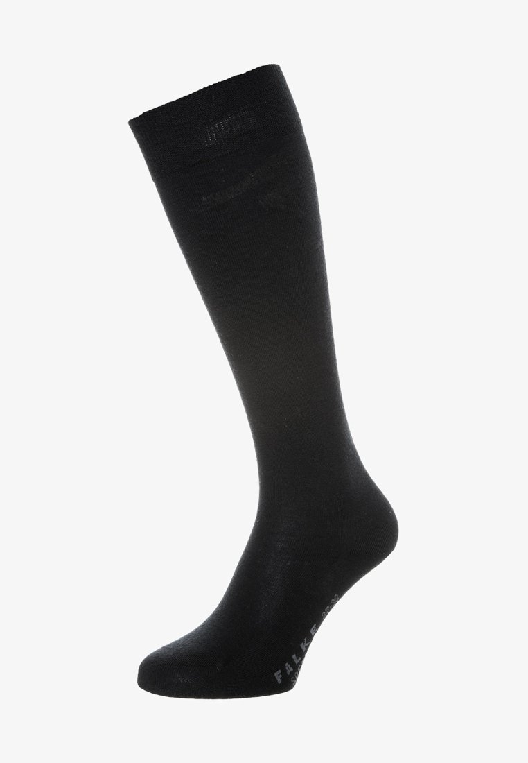 Meia preta até ao joelho, feita de um material liso e elástico. Apresenta um logótipo subtil no tornozelo, com um design ajustado e sem costuras.