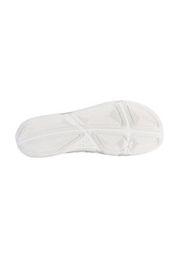 White athletic shoe sole with textured grip patterns, featuring a smooth surface and subtle branding. Curved and streamlined design.