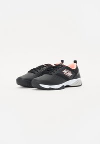 Black athletic shoes featuring a textured surface, pink accents, and a white sole. The design includes perforations for breathability and a secure fit.